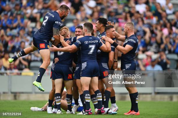 Cowboys celebrate a Scott Drinkwater try during the round one NRL match between the North Queensland Cowboys and the Canberra Raiders at Qld Country...