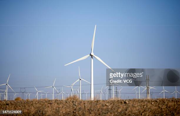 Wind turbines operate at the Gobi Desert on March 3, 2023 in Yumen, Gansu Province of China.