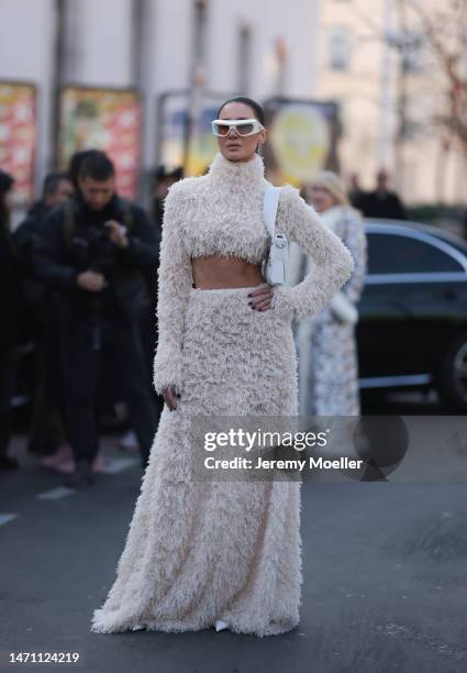 Sabina Jakubowicz seen wearing a white fluffy Dawid Wolinski dress, white Coperni sunnies and Versace heels before the Giambattista Valli show on...