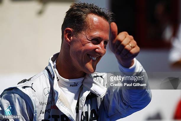 Michael Schumacher of Germany and Mercedes GP celebrates in parc ferme after finishing third during the European Grand Prix at the Valencia Street...