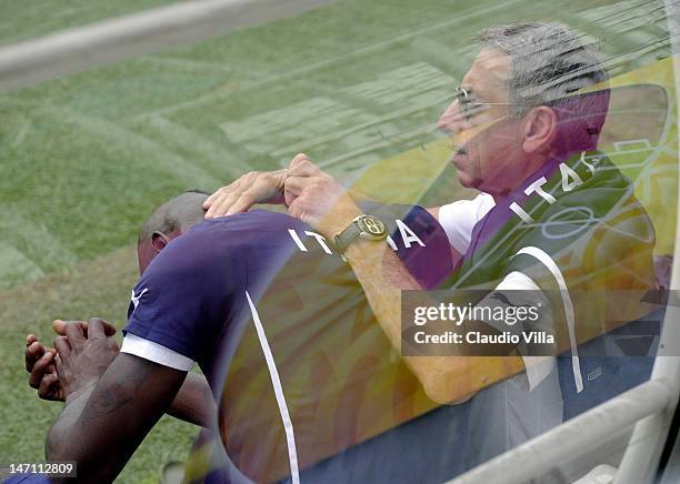 Mario Balotelli of Italy and Doctor Enrico Castellacci during a training session at Marshal Józef Pilsudski Stadium on June 25, 2012 in Krakow,...