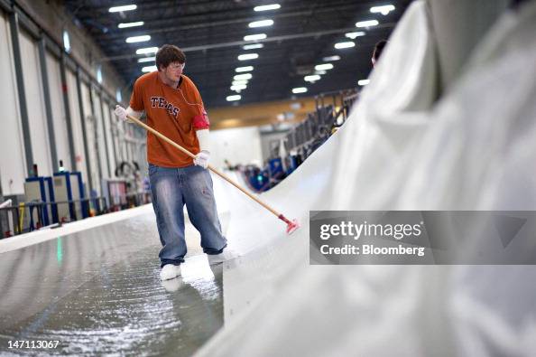 Dyllon Shultz Employee Dillon Schultz smoothes the first of many layers of... News ...