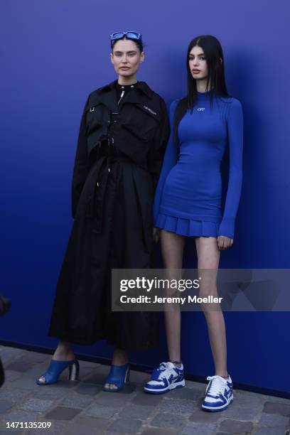 Bianca Balti and Matilde seen wearing a full black outfit, black Off-White jacket and blue sunglasses and a short blue Off-White dress outside...