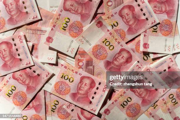 chinese yuan note (renminbi) textured background - yuan symbol stock-fotos und bilder