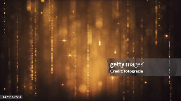 golden shining glittery background - s rain or shine stockfoto's en -beelden