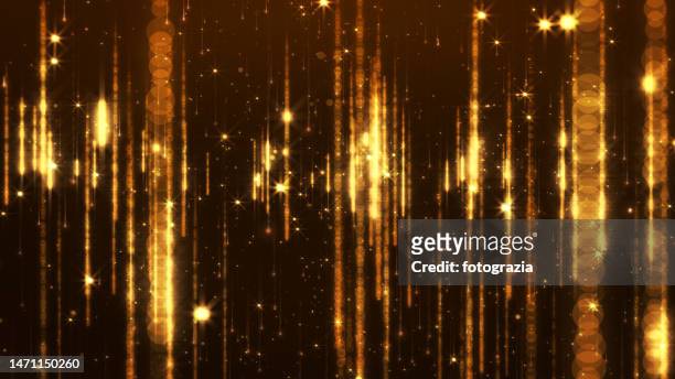 shining golden sparkles - gala background stock pictures, royalty-free photos & images