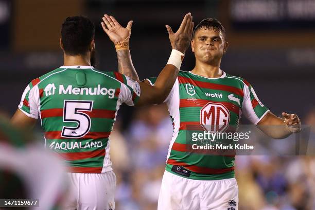 Izaac Thompson and Latrell Mitchell the Rabbitohs celebrate victory during the round one NRL match between Cronulla Sharks and South Sydney Rabbitohs...