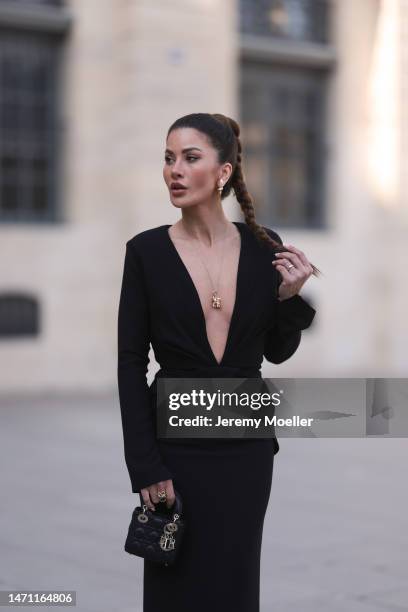 Füsun Lindner seen wearing Maison Ju black v-neck long dress with long sleeves, Ole Lynggaard gold elephant pendant necklace and gold ring, Louis...