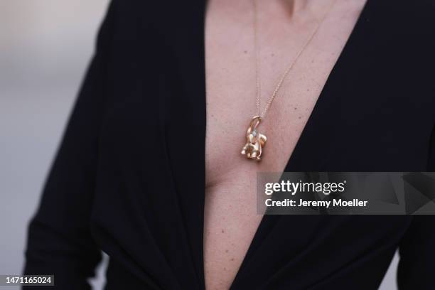 Füsun Lindner seen wearing Maison Ju black v-neck long dress with long sleeves, Ole Lynggaard gold elephant pendant necklace, during Paris Fashion...