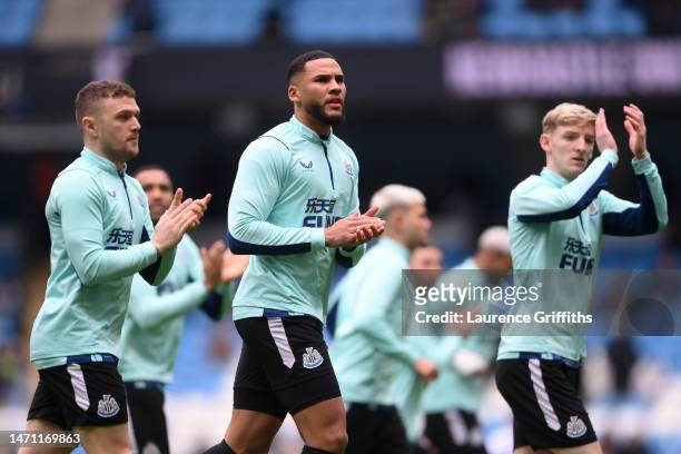 Kieran Trippier and Jamaal Lascelles of Newcastle United warm up prior to the Premier League match between Manchester City and Newcastle United at...