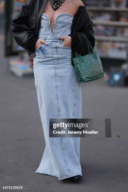 Karin Teigl seen wearing H&M Studio light blue sleeveless denim / jeans long dress, Edited black leather bomber jacket, Chanel black bandana with...