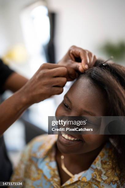 close up happy woman at the hairdresser - african hair stock pictures, royalty-free photos & images