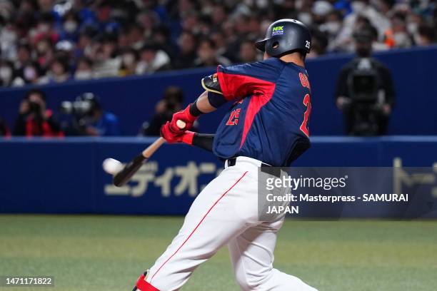Infielder Kazuma Okamoto of Samurai Japan hits a solo home run in the seventh inning during the practice game between Samura Japan and Chunichi...