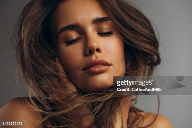 beautiful emotional woman with natural make-up - brons stockfoto's en -beelden