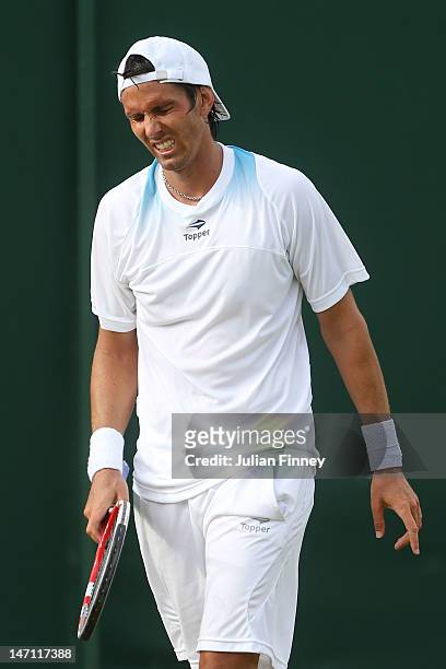 Juan Ignacio Chela of Argentina shows his dejection during his gentlemen's singles first round match against Martin Klizan of Slovakia on day one of...