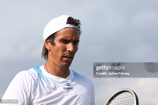 Juan Ignacio Chela of Argentina looks on during his gentlemen's singles first round match against Martin Klizan of Slovakia on day one of the...