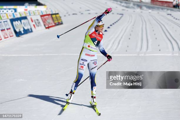Gold medalist Ebba Andersson of Sweden celebrates victory after the Cross-Country Women's 30km Mass Start Classic at the FIS Nordic World Ski...