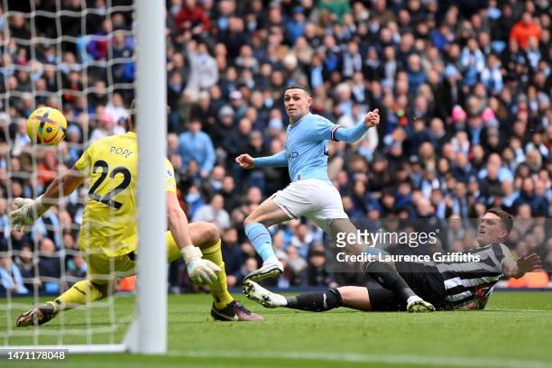 Phil Foden of Manchester City scores the team's first goal during the Premier League match between Manchester City and Newcastle United at Etihad...