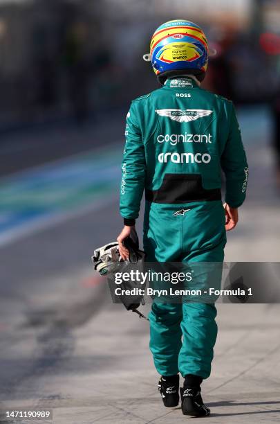 Fernando Alonso of Spain and Aston Martin F1 Team walks in the Pitlane during final practice ahead of the F1 Grand Prix of Bahrain at Bahrain...