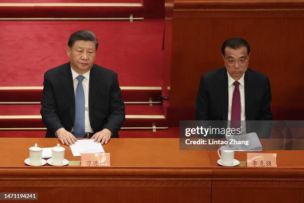 Chinese President Xi Jinping and Chinese Premier Li Keqiang attend the opening of the first session of the 14th Chinese People's Political...
