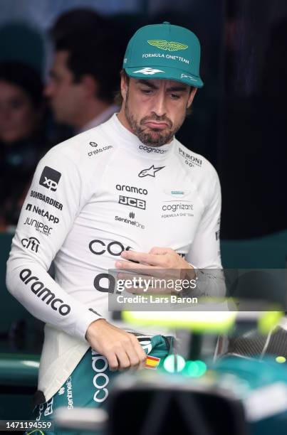 Fernando Alonso of Spain and Aston Martin F1 Team prepares to drive in the garage during final practice ahead of the F1 Grand Prix of Bahrain at...