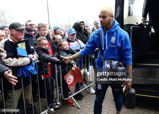 Juninho Bacuna of Birmingham City high fives fans on arrival at the stadium prior to the Sky Bet Championship between Wigan Athletic and Birmingham...