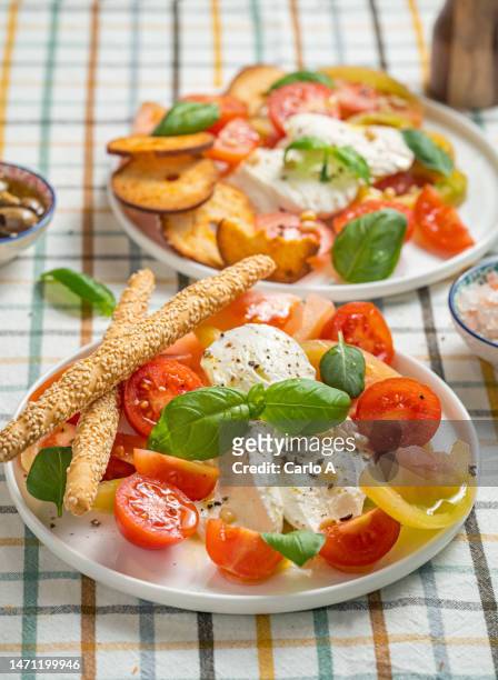 tomato and mozzarella - brotstange stock-fotos und bilder