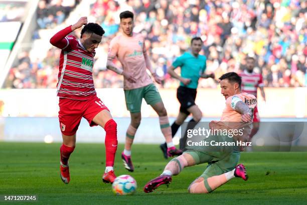 Ruben Vargas of FC Augsberg is challenged by Marco Friedl of SV Werder Bremen during the Bundesliga match between FC Augsburg and SV Werder Bremen at...