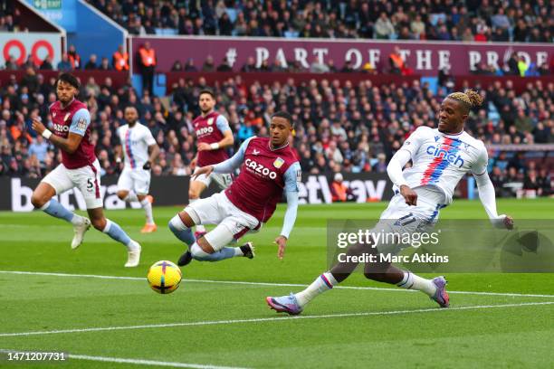 Wilfried Zaha of Crystal Palace scores a goal that is later disallowed by VAR during the Premier League match between Aston Villa and Crystal Palace...