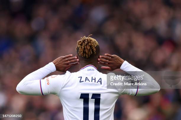 Wilfried Zaha of Crystal Palace celebrates after scoring a goal which is later disallowed by VAR during the Premier League match between Aston Villa...