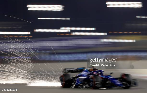 Sparks fly behind Logan Sargeant of United States driving the Williams FW45 Mercedes during qualifying ahead of the F1 Grand Prix of Bahrain at...