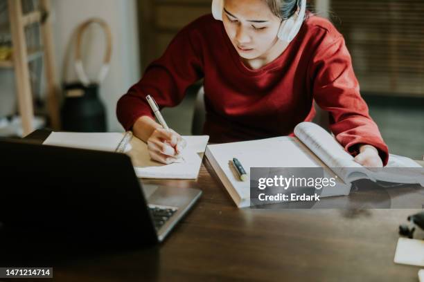 young asian woman with hand disability is studying on online class. - bachelor stockfoto's en -beelden