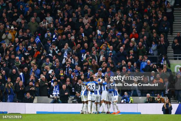 Joel Veltman of Brighton & Hove Albion celebrates with teammates after scoring the team's second goal during the Premier League match between...