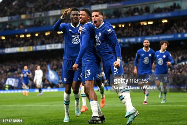 Wesley Fofana of Chelsea celebrates with teammates Benoit Badiashile and Enzo Fernandez after scoring the team's first goal during the Premier League...