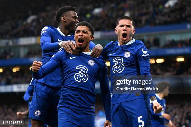 Wesley Fofana of Chelsea celebrates with teammates Benoit Badiashile and Enzo Fernandez after scoring the team's first goal during the Premier League...