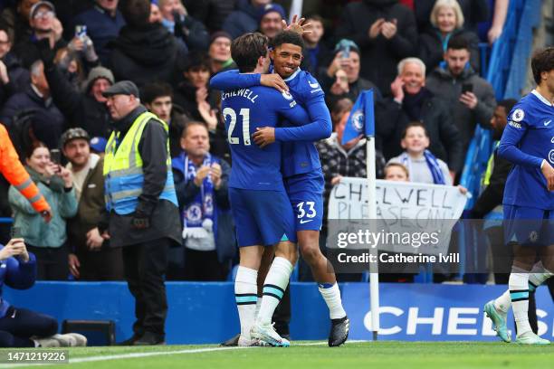 Wesley Fofana of Chelsea celebrates with teammate Ben Chilwell after scoring the team's first goal during the Premier League match between Chelsea FC...