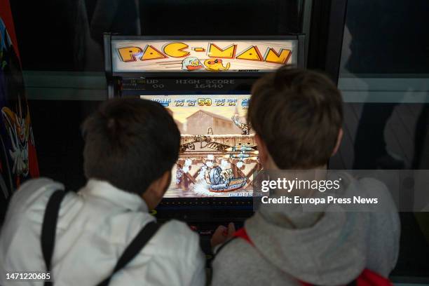 Two boys play Pac-Man during the celebration of the third edition of the Salon del Comic de Valencia, on March 4 in Valencia, Valencian Community,...