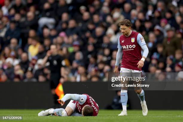 Calum Chambers of Aston Villa lies injured from a tackle by Cheick Doucoure of Crystal Palace, which led to him receiving a red card during the...