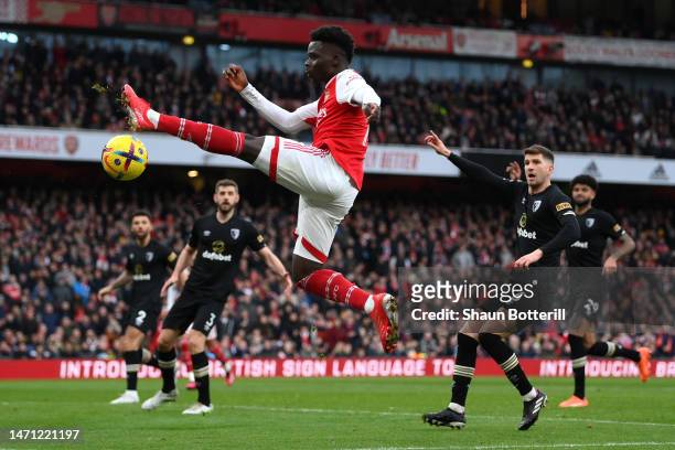 Bukayo Saka of Arsenal stretches for the ball during the Premier League match between Arsenal FC and AFC Bournemouth at Emirates Stadium on March 04,...
