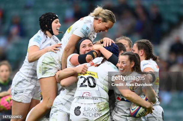 Ebony Jefferies of Exeter Chiefs celebrates with teammates after scoring a try during the Women's Allianz Premier 15s match between Harlequins and...