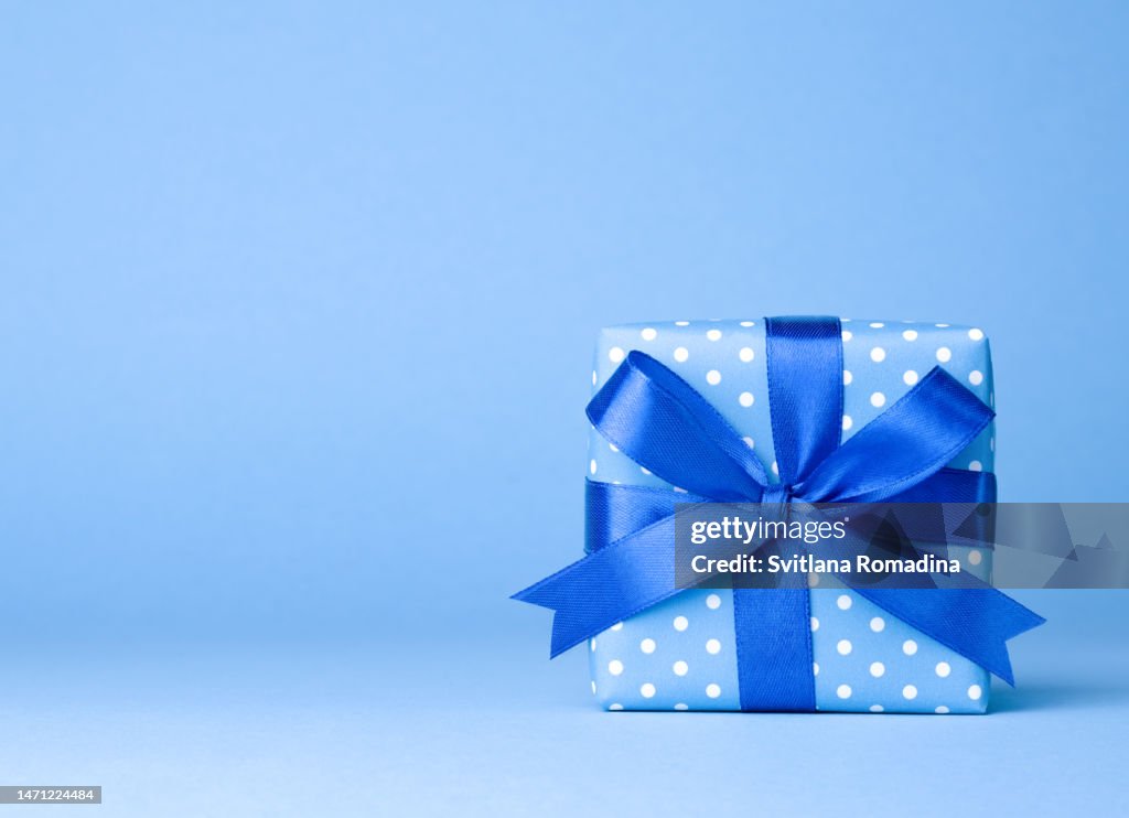 Holiday present on blue background