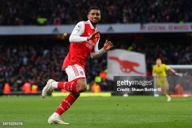 Reiss Nelson of Arsenal celebrates after scoring the team's third goal during the Premier League match between Arsenal FC and AFC Bournemouth at...