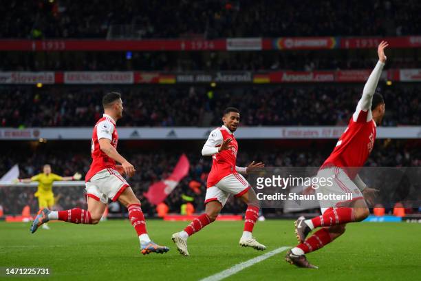 Reiss Nelson of Arsenal celebrates with teammates after scoring the team's third goal during the Premier League match between Arsenal FC and AFC...