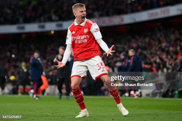 Oleksandr Zinchenko of Arsenal celebrates the team's third goal, scored by teammate Reiss Nelson during the Premier League match between Arsenal FC...