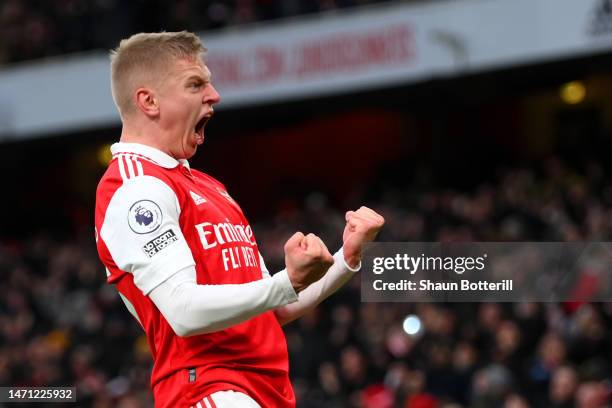 Oleksandr Zinchenko of Arsenal celebrates the team's third goal, scored by teammate Reiss Nelson during the Premier League match between Arsenal FC...