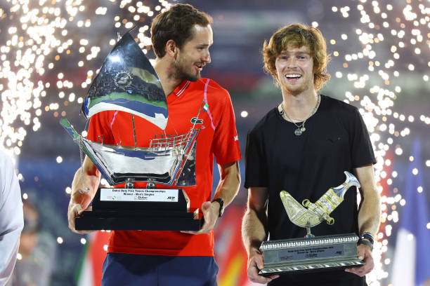 Daniil Medvedev and Andrey Rublev celebrate with their respective trophies after the Men's Final Single's match on day fourteen of the Dubai Duty...