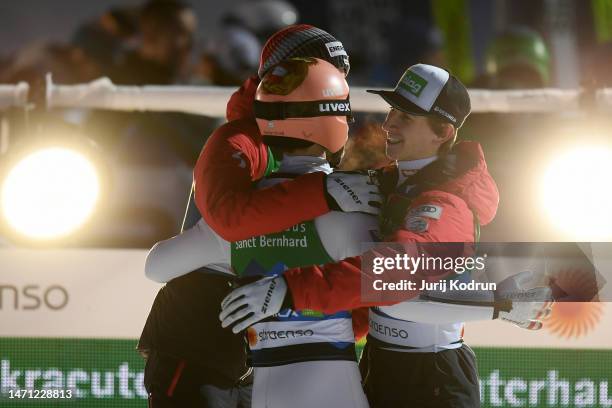 Michael Hayboeck of Team Austria celebrates with Daniel Tschofenig of Team Austria during the Ski Jumping Men's Team HS138 at the FIS Nordic World...