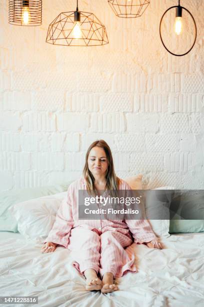 a woman in the bed - good; times bad times stock pictures, royalty-free photos & images