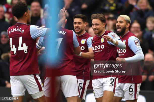 Players of Aston Villa celebrate their teams first goal, an own goal scored by Joachim Andersen of Crystal Palace during the Premier League match...