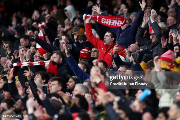 Arsenal fans celebrate victory following the Premier League match between Arsenal FC and AFC Bournemouth at Emirates Stadium on March 04, 2023 in...